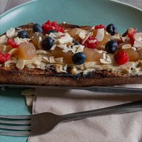 Sweet and savory on toasted sourdough - peanut butter - poached apples, fresh berries and almonds  at Mayvn in Edinburgh