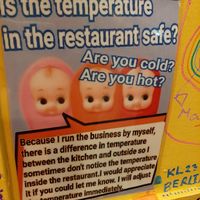 Cute signage on the walls at OKO Takoyaki in Osaka