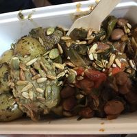 Roast potatoes, ratatouille, olive tapenade topped with seeds at Alpha Bar in Oxford