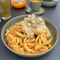 Kräuterseitling-Schnitzel mit Curly Fries  at Project Vegan in Koblenz