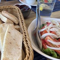 Pitta, tomato and white onion salad  at Symposium in Limassol