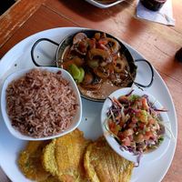Caribbean "Vicken" plate, including a passionfruit dressed cabbage salad, rice & beans, and patacones. at Salsa Brava Restaurante Caribeño in Puerto Viejo De Talamanca