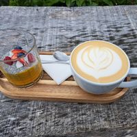 Oat milk latte and mango chia pudding at Panorama Cafe  in Turnov