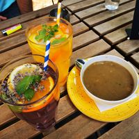 Vegan lentil cream soup, mango and lavender lemonade at Vasmacska KávéZoo in Budapest
