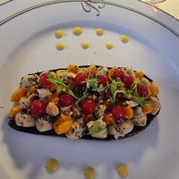 Grilled aubergine, chickpea hummus, carrot cream, toasted cashews,                                                              chia seeds, lime gel, currants and sprouts at Ristorante dei Poeti in Sirmione