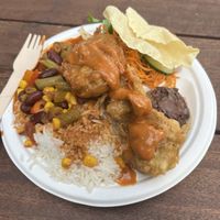 Chili beans with rice, salad, chocolate banana pudding for $10 + I added a poppadom and a potato fritter for $1 each   at Conscious Eats in Auckland