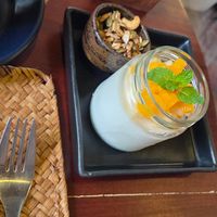 Fruit yogurt with granola at Grasshopper Cafe in Luang Prabang