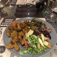 Buffalo broccoli (incredible) with salad  at Cooper's Bar and Restaurant in Abu Dhabi