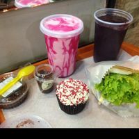 Negresco pie, brigadeiro, mulberry cupcake, strawberry milkshake, acai juice and 'cheff's burger'. at Prime Dog - Vila Mariana in Sao Paulo