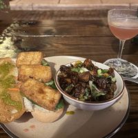 Banh Mi on left, BBQ Brussel Sprouts & Cosmo on right   at Forgotten Tonic in St Augustine