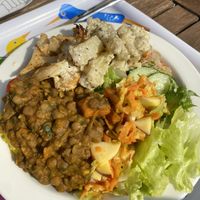 lentil stew and rice, potato salad, roasted cauliflower and multiple different salads  at Restaurant Seili in Nagu