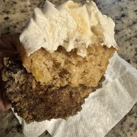 The moist goodness bite into the peach cupcake   at Buttafly Kisses Vegan Treats in Austell