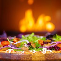 The Beyond Meat Pizza
Made from mostly Organic, and 100% Vegan ingredients, the Slow Roasted Pizza comes with a heavy layer of Organic Spring Lettuces, followed by perfectly   at Avatara Pizza in Calgary