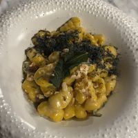 Homemade pumpkin gnocchis in vegan sage butter and black vegan Parmesan   at Plant Bistro in Ubud