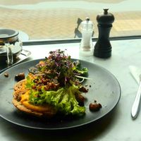Sourdough with pumpkin-white beans créme, sage, chestnut champignons, pits and seeds at Foelie in Antwerpen