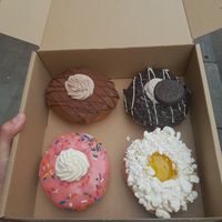 Clockwise: Triple Chocolate, Oreo, Lemon Meringue, and The Homer at Golden Glaze Dougnuts  in Worcester