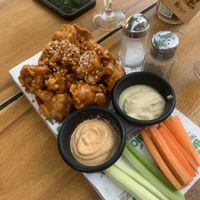 Cauliflower wings. Decent but could use more seasoning in the batter. Also wish it was served with a vegan ranch   at Bio & Natural - Con Constituyentes in Playa Del Carmen