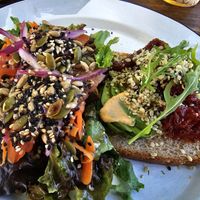 This was some avocado toast with sunrise tomatoes and the salad was sesame sunflower and pumpkin seeds... Absolutely delicious. at Bio & Natural - Con Constituyentes in Playa Del Carmen