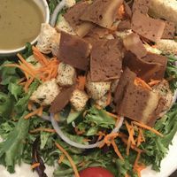 Large garden salad with sesame tahini dressing and Herbivorous Butcher bacon (personal fave).  at Pizza Luce - Lyndale Ave in Minneapolis