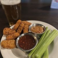 Lucky Bird Nuggets with sweet chili peanut, sweet chili sauce, and local beer option 🍻❤️  at Pizza Luce - Lyndale Ave in Minneapolis