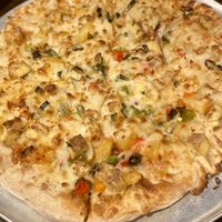 Vegan Fire Breathing Dragon pizza with sweet chili sauce, spicy Jerk tofu, pineapple salsa, green onion and vegan cheese 💚  at Pizza Luce - Lyndale Ave in Minneapolis