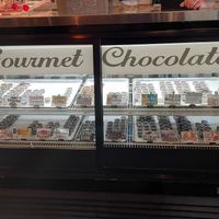 Display for gourmet chocolates. Prices range from $1-3. All vegan, except some with honey. at Oh Mi Organics in St Johns