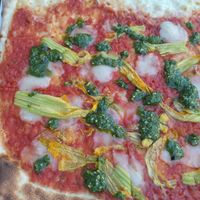 Pizza 'Veghu' with pesto, zucchini flowers and cheese by Veghu. at Les Arenes in Alghero