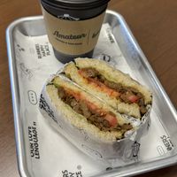 Latte + anticuchero  at Amateur Coffee & Run Club in Lima