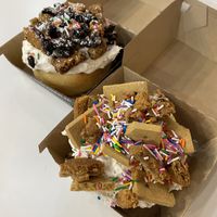 Top to bottom: Santa’s milk and cookies roll, gingerbread house roll   at Cinnaholic - Longview Common in Calgary