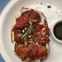 toast com pasta de castanha de caju fermentada, tomate assado, abobrinha, berinjela e amêndoa!  at Santiago Padaria Artesanal  in Sao Paulo