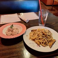 Pink potato salad and lemon picatta pasta with vegan chicken at Vida Cafe in Fort Worth