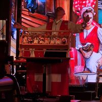 Playing an instrument made of alcohol at Stadtkeller in Luzern