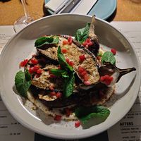 Aubergine, coco yogourt sauce, harissa, pomegrenade, minth at Zermatt Kitchen in Zermatt