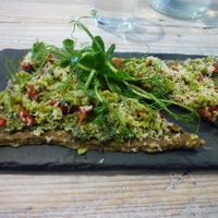 The delicious pesto pizza! at Nama Artisan Raw Foods in West London