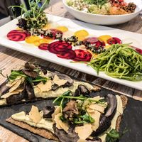 Brunch for champions! Fungi pizza and Mexican bowl! at Nama Artisan Raw Foods in West London