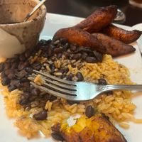 Mixing of the beans, plantains, & rice at Brian's Place in Spring Hill