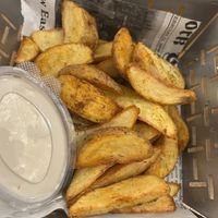 Potato wedges with vegan mayo  at m'EAT ME Gastro Bar in Sarajevo