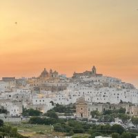View from across the road of the sunset over Ostuni   at Restaurante II Bistrot in Ostuni