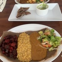 Gurshu combo and Tofu tibs in the back   at Bersi Ethiopian Restaurant in Brooklyn