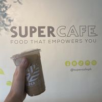 interior with vegan spanish latte  at SuperCafe PH  in Quezon City