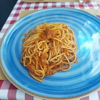 Vegan friggione with spaghetti at Mattarello in Bologna