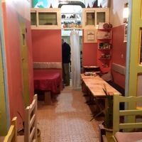 A tiny kitchen hides behind the pink walls. at Shyadma's Vegan Food in Essaouira