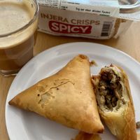 Sambusa, cortado w/oat milk, injera crisps to snack on later  at Buna Kurs in Richmond