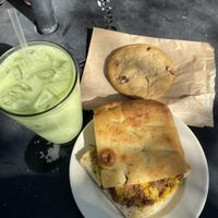 Vegan breakfast sandwich, vegan salted chocolate chip cooked and a matcha latte w/oat milk (I did add agave for sweetness myself )  at Magpie Cafe in Baton Rouge