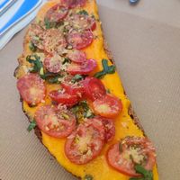 Tostada de queso casero vegano con albahaca y cherrys (buenísima) at La Aldea Cafe Bar in Conil De La Frontera