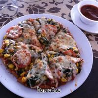 For India, I was pretty impressed by this pizza. I'm a real pizza connoisseur, but I'd gladly pay $3 for this 11' pizza back home.  at Orchids Restaurant in Varanasi