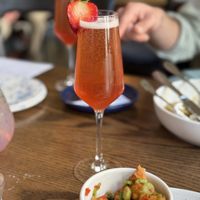 Champagne cocktail with strawberry syrupp  at Blossom & Root Kitchen in Danville