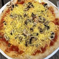 Vegan cheese on pizza  at Paradiso  in Graz