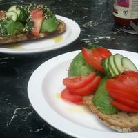 Gallery Cafe, avocado on toast (bare in front, regular with pesto behind) at The Gallery Cafe in East London