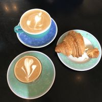 Latte, Flat white and plain croissant  at The Gallery Cafe in East London